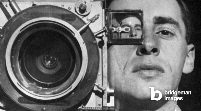 Mikhail Kaufman poses with a camera taking a self-portrait This is a still from the film Man with a Movie Camera by Dziga Vertov